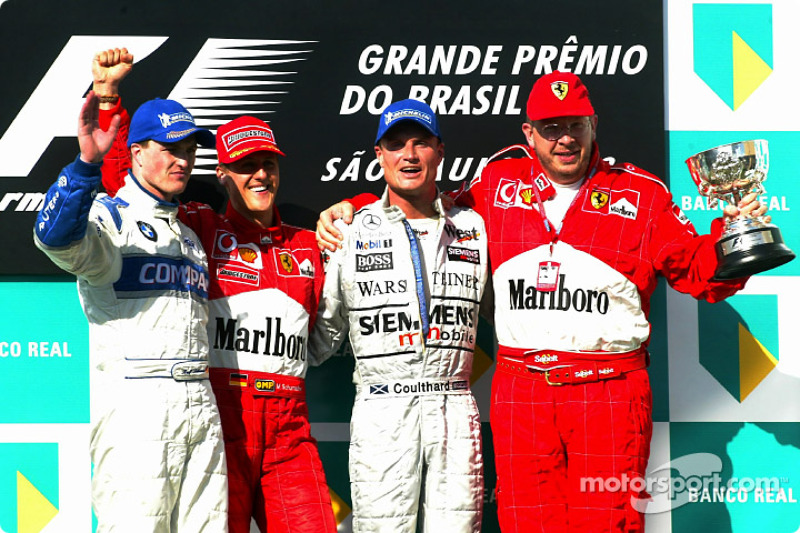 The podium: race winner Michael Schumacher with Ralf Schumacher, David Coulthard and Ross Brawn