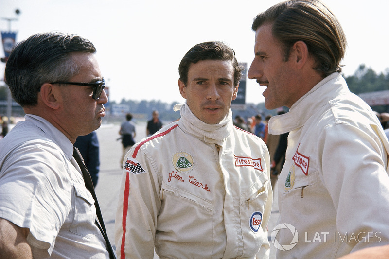 Lotus drivers Jim Clark and Graham Hill with Walter Hayes, public relations executive for Ford