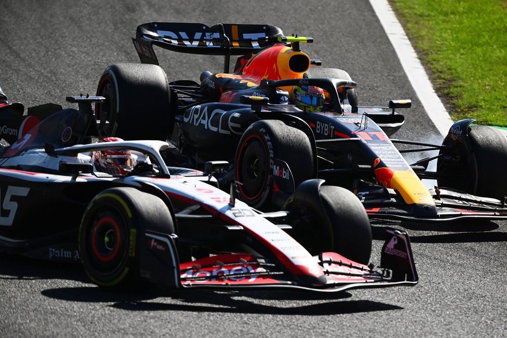 Kevin Magnussen, Haas VF-23, Sergio Perez, Red Bull Racing RB19