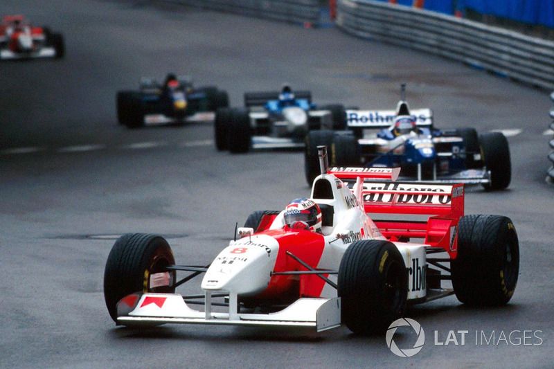 David Coulthard, McLaren MP4/11B, wearing Michael Schumacher's spare helmet