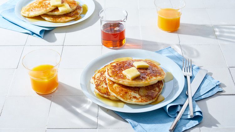 gluten free buttermilk pancakes on white plate at breakfast